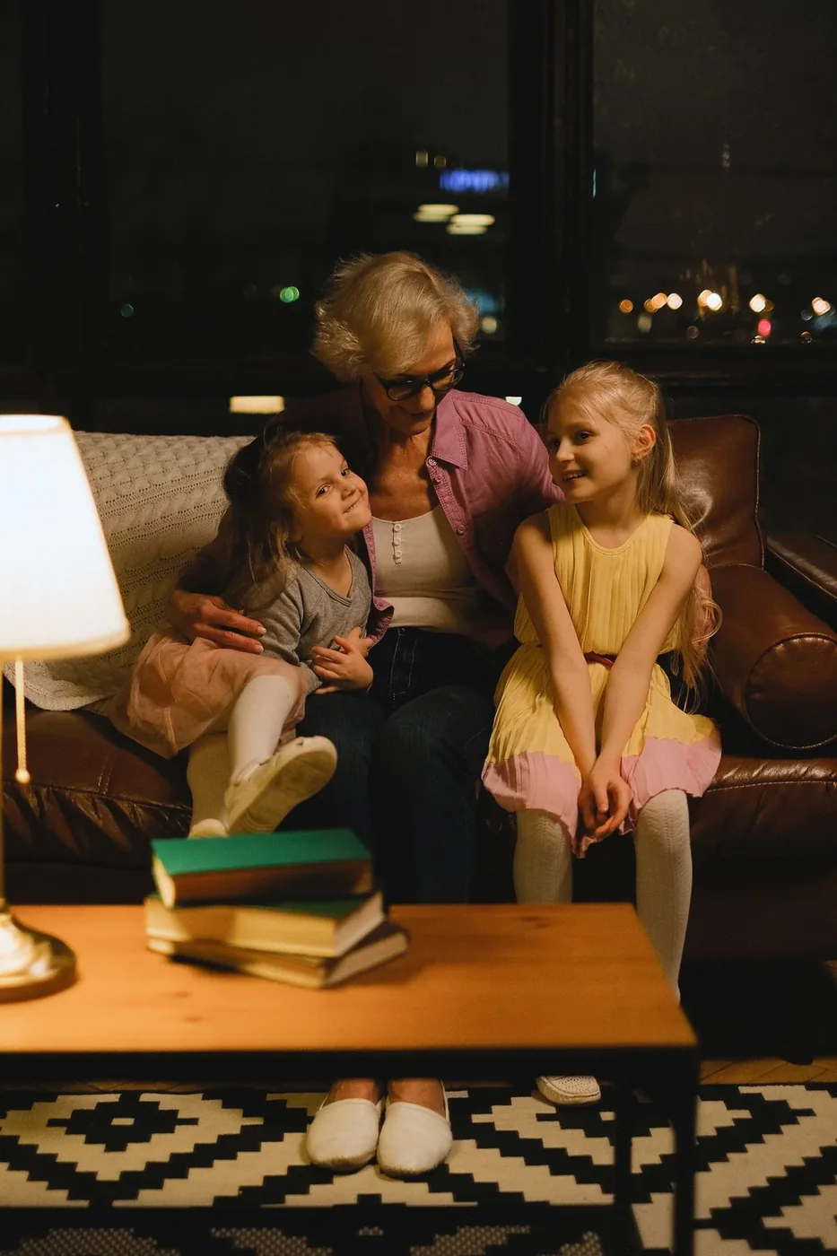 A grandmother sharing a happy moment with two children